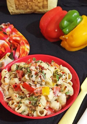A picture of Macaroni in Mushroom and bell pepper sauce.