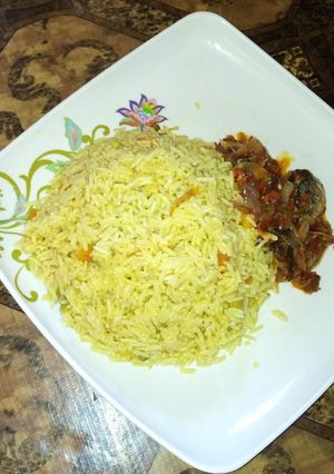 A picture of Fried rice with pepper sauce.