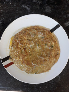 Una foto de Tortilla de cebolla con alcachofas