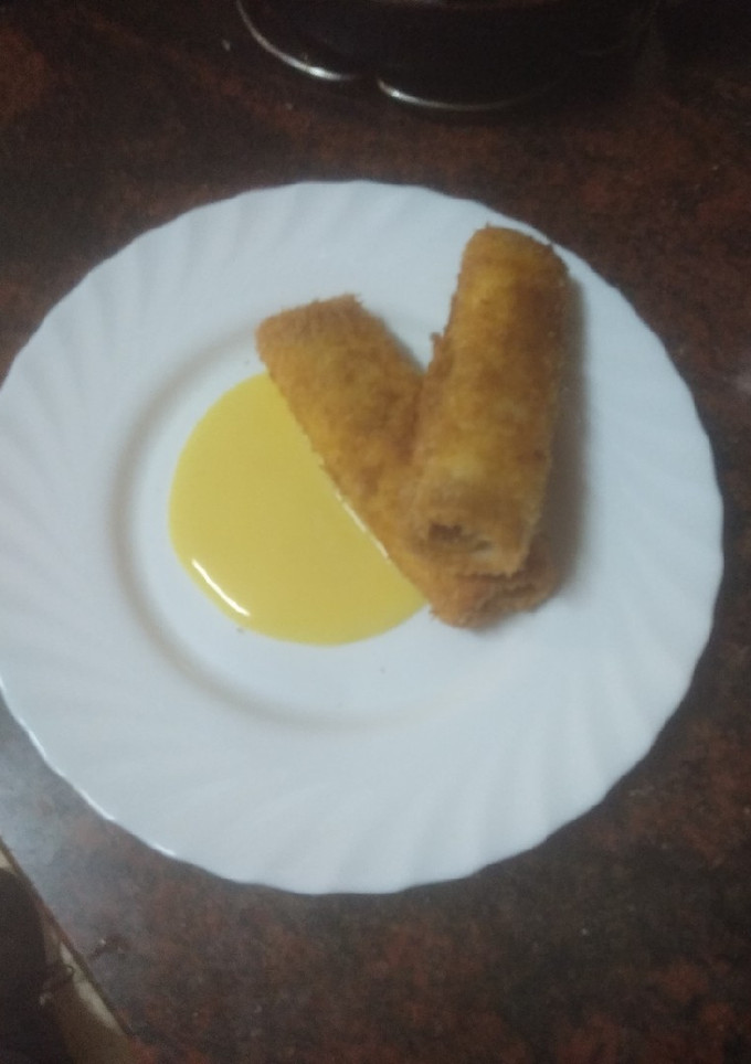 Una foto de Cañas de dulce de membrillo y queso fresco con natillas
