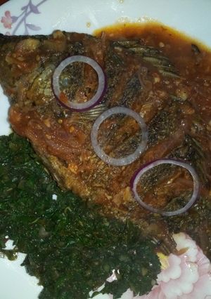 A picture of Fried fish,ugali with greens(kunde,managu,terere and spinach).