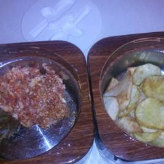 A picture of Fried potatoes with egg sauce.