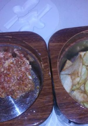 A picture of Fried potatoes with egg sauce.