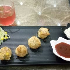 A picture of Cheese balls with mint mayo dip.