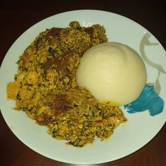 A picture of Egusi soup and Semivita.