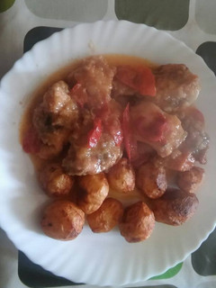 Una foto de Pollo con pimientos y cebolla