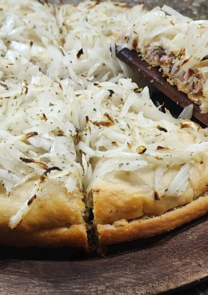 Una foto de Fugazzeta rellena v2 - Rellena de jamón, muzzarella y champiñones