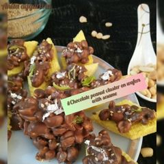 A picture of Chocolate peanut cluster on wafers with sesame.