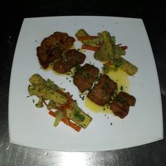 A picture of Fish meuniere with saute vegetables.