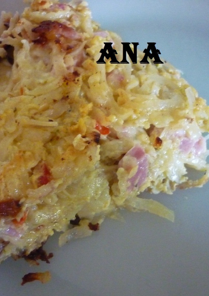 Una foto de Tortilla de papas ralladas rellena