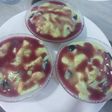Pista fruit custard orange jelly with black currant sauce