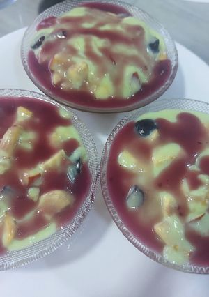 A picture of Pista fruit custard orange jelly with black currant sauce.