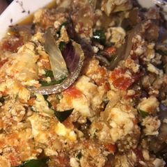 A picture of Egg sauce with fried plantain.