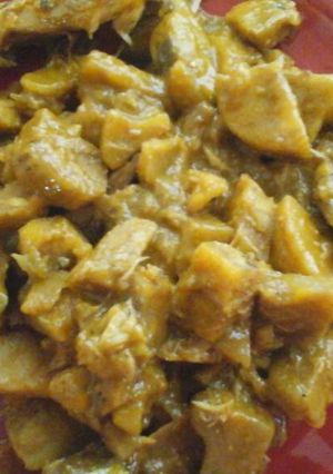 A picture of Unripe plantain with dry fish.