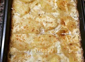 Una foto de Papas a la crema gratinadas