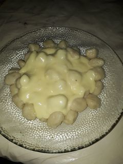 Una foto de Ñoquis de papa con salsa 4 quesos
