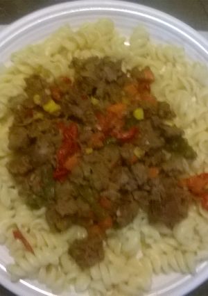A picture of Fusilli italian pasta with robot mince.