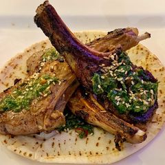 A picture of Crispy lamb chops and a Cypriot salsa verde.