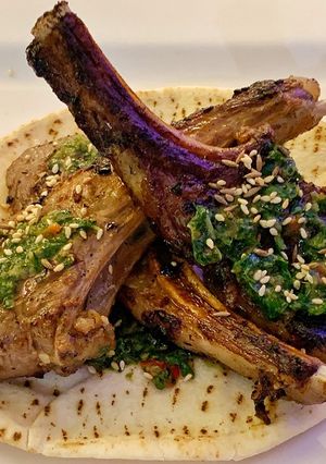 A picture of Crispy lamb chops and a Cypriot salsa verde.
