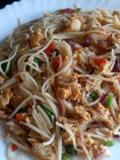 A picture of Simple fried eggs with spaghetti.