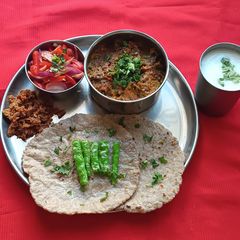 A picture of Ringan (Brinjal) Oro and Sorghum, Pearl Millet Chapti.