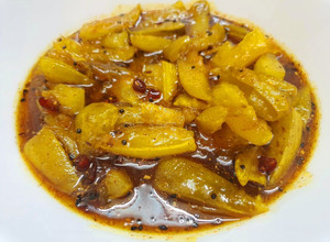 A picture of Aamer Tok Jhaal Misti Achar or Sweet,Sour and Spicy Mango Pickle.