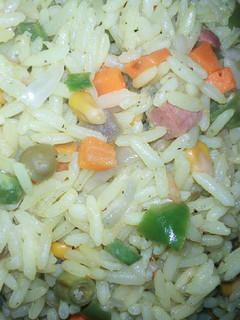 A picture of Fried rice with pepper chicken.