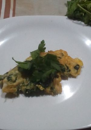 Una foto de Tortilla con rucula