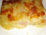 Parmigiana di patate con prosciutto cotto e formaggio