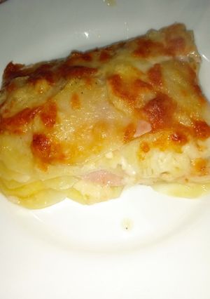 A picture of Potato Parmigiana with Ham and Cheese.