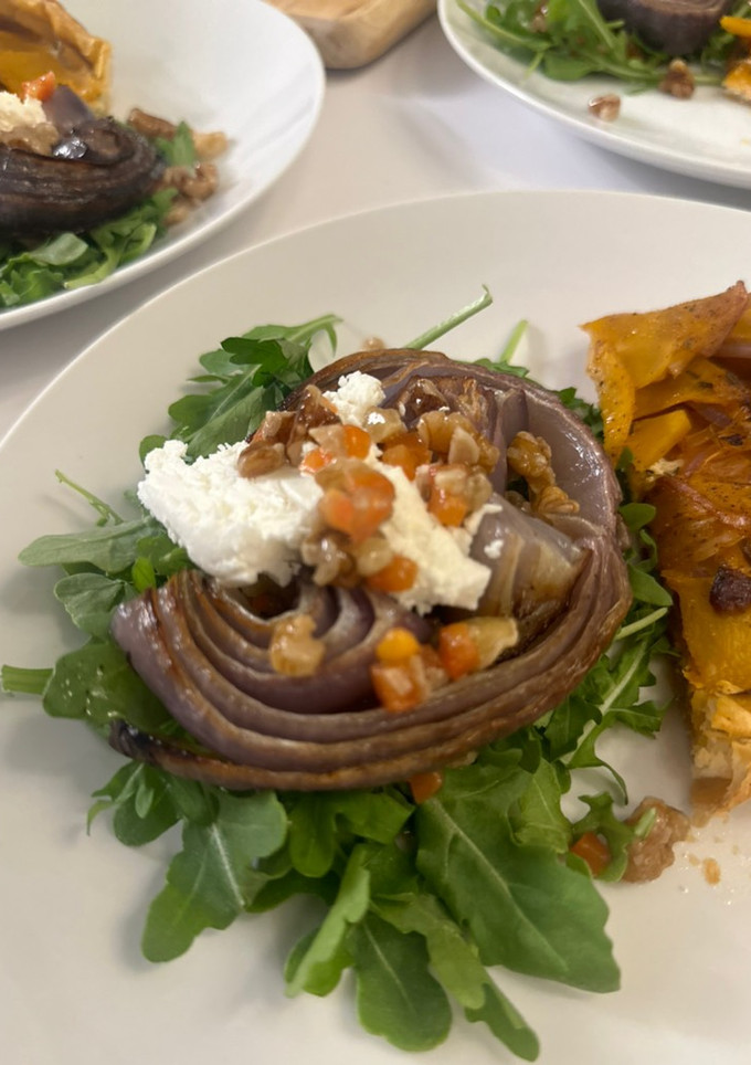 A picture of Roasted Onion and Arugula Salad with Walnut Salsa.