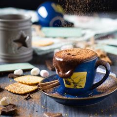 A picture of Hot chocolate with cinnamon and orange.