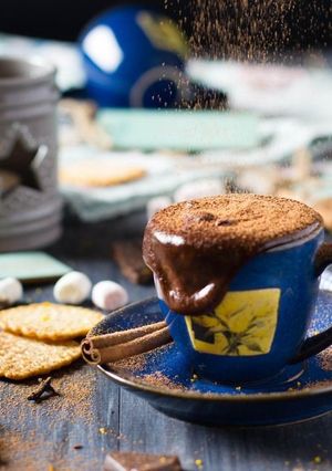 A picture of Hot chocolate with cinnamon and orange.