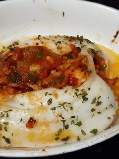 Una foto de Sepia al horno con bacon