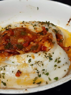 Una foto de Sepia al horno con bacon