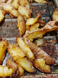 A picture of Baked potato wedges.