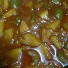 A picture of Shimla mirch and aloo with gravy.
