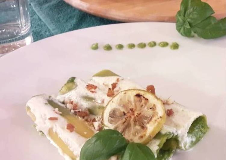 Cannelloni al pesto mandorlato su salsa al pecorino