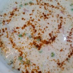 A picture of Alu matar raita 🥔.