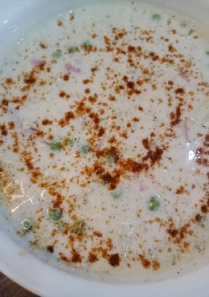 A picture of Alu matar raita 🥔.