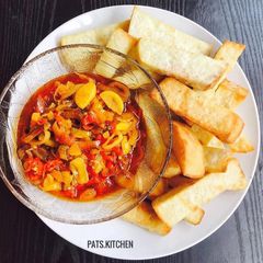 A picture of Onion, Pepper Sauce with Fried Yam.