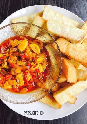 A picture of Onion, Pepper Sauce with Fried Yam.