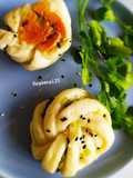 Pan fried scallions and toasted sesame bun