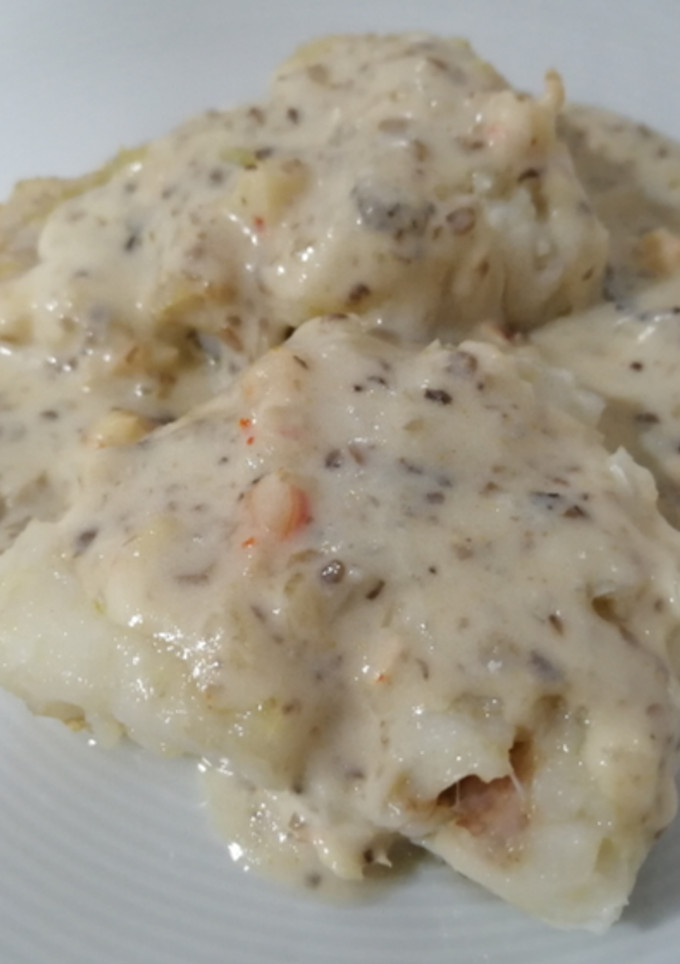 Una foto de Merluza con crema de gambas