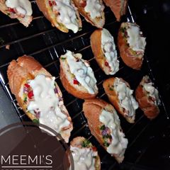 A picture of Pizza style mini chicken baguette.