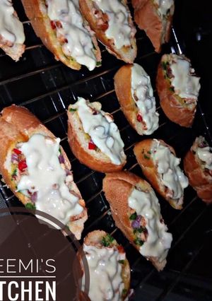 A picture of Pizza style mini chicken baguette.