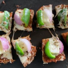 A picture of Cheese burst paneer tikka pizza.