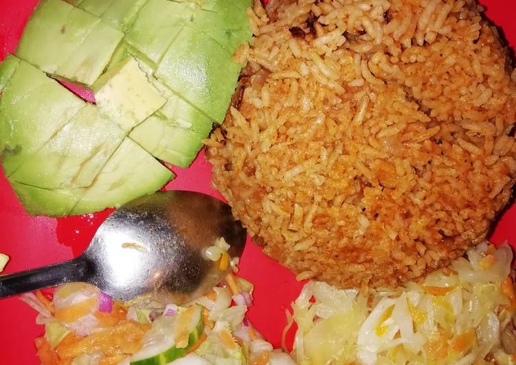Pilau served with cabbage and salad