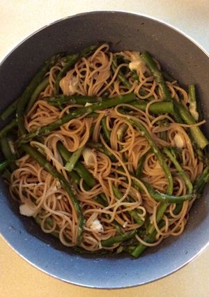 A picture of Asparagus spaghetti with goat cheese.