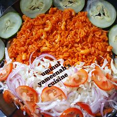A picture of RICE AND macaroni JOLLOF.
